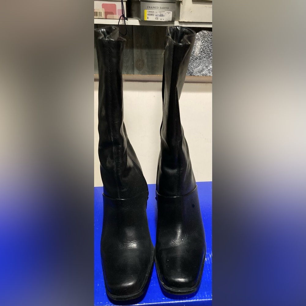 Black size 8 mid calf leather boots.